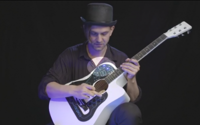 He Places A Weird Device Onto His Guitar. The Sound It Makes Boggles My Mind!