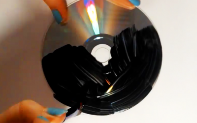 Instead Of Tossing Her Old CDs In The Trash, She Paints Them Black. But, When She’s Done? STUNNING